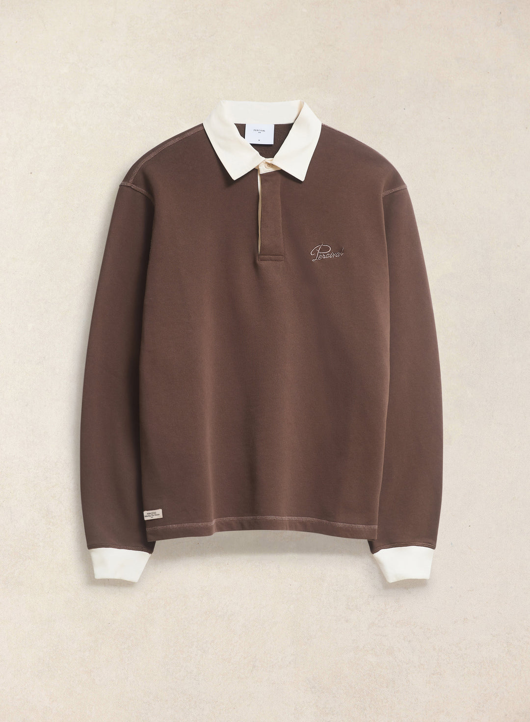 Percival Editor Embroidered Rugby Polo in brown flat lay
