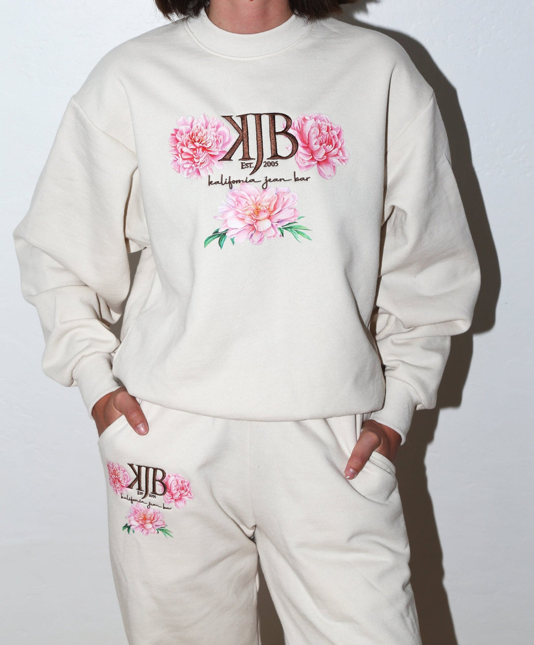 Bronze Embroidered KJB Flower Crewneck in Creme - Kalifornia Jean Bar Bronze Embroidered KJB Flower Crewneck in Creme