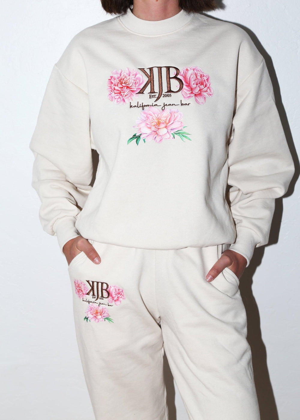 Bronze Embroidered KJB Flower Sweatpants in Creme - Kalifornia Jean Bar Bronze Embroidered KJB Flower Sweatpants in Creme