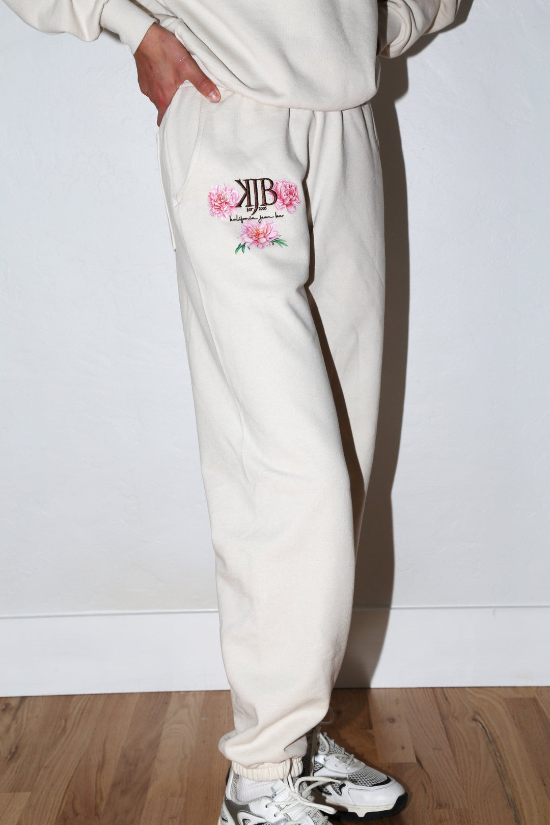 Bronze Embroidered KJB Flower Sweatpants in Creme - Kalifornia Jean Bar Bronze Embroidered KJB Flower Sweatpants in Creme